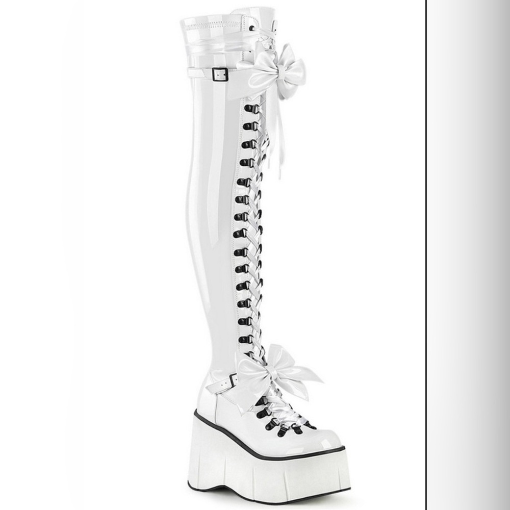 Demonia white faux patent leather lace up platform boots with bow accents. Sz 9